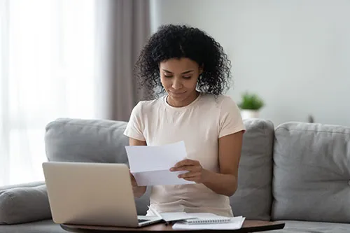 woman entering financial info