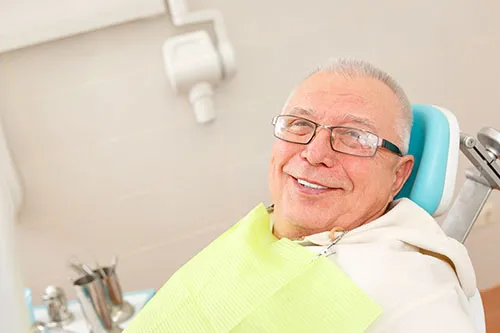 smiling older man at dental office